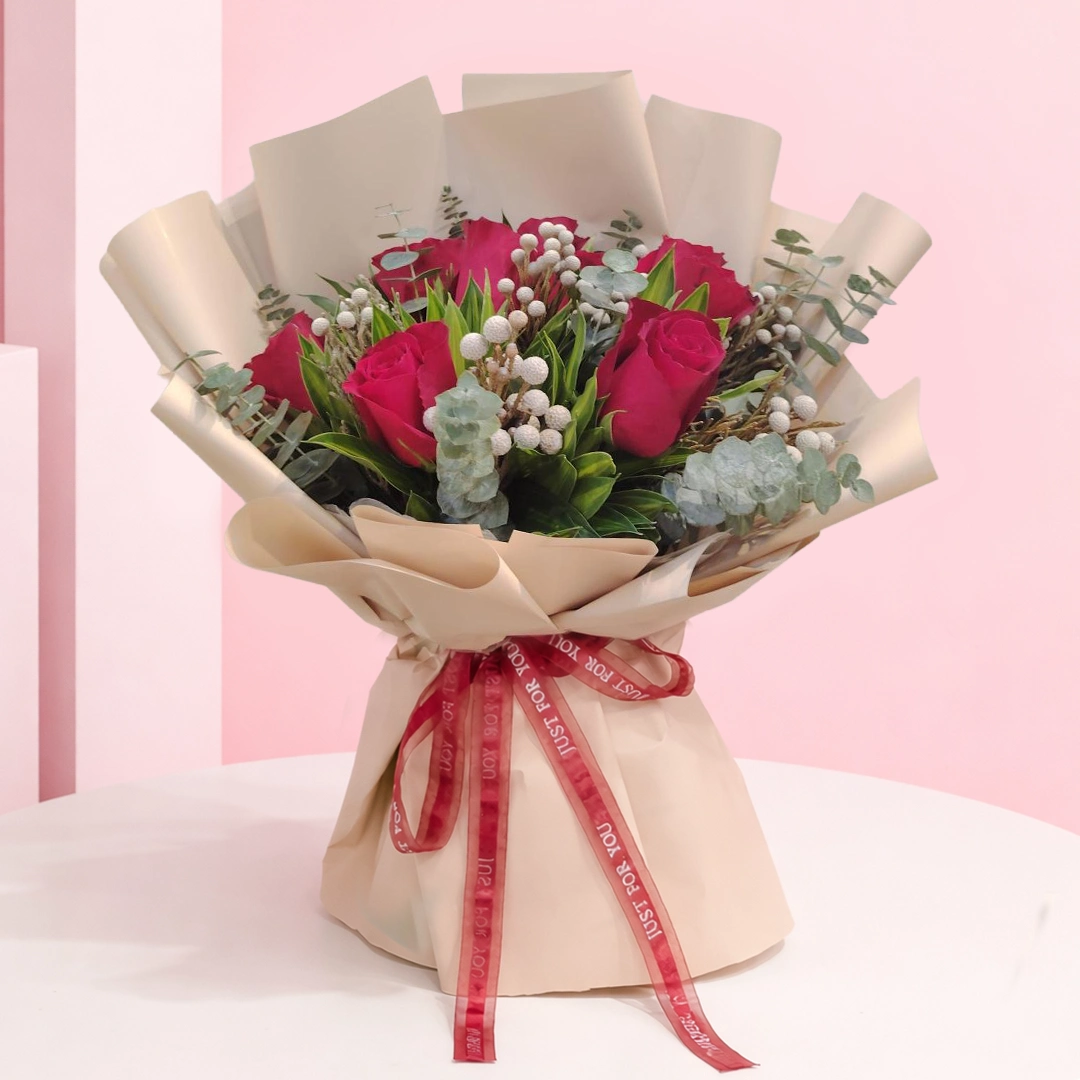 01 Rustic Charm Bouquet featuring roses, brunia, and eucalyptus arranged in a natural rustic bouquet for gifting