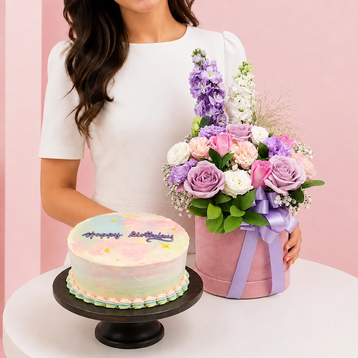 chocolate-chiffon-flowers-combo Chocolate Chiffon & Flowers Combo featuring a bouquet of lavender and pink roses, eustoma, matthiola, and fillers paired with a Black Forest cake made with chocolate chiffon, fresh cream, and dark sweet cherries.