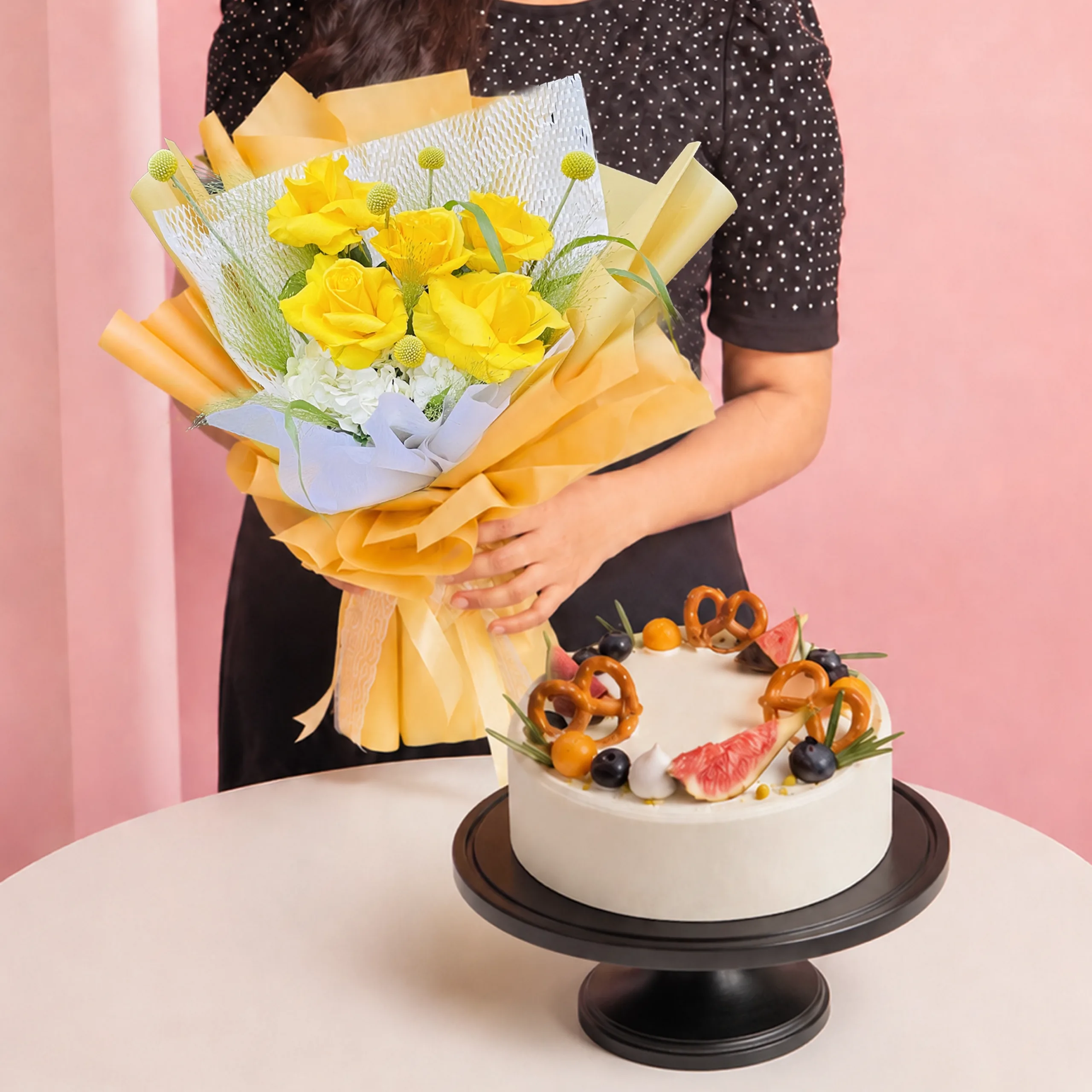 golden-flowers-chiffon-cake-combo Golden Flowers & Chiffon Cake Combo featuring a hand bouquet of yellow roses and seasonal flowers paired with a pandan chiffon cake made with gula melaka and coconut mousse.
