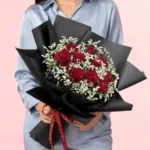 Passionate Red Rose Bouquet featuring fresh red roses and delicate gypsophila elegantly arranged in a sophisticated black wrapping.
