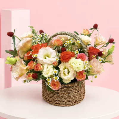 Fresh roses, spray roses, lisianthus, complementary fillers, and lush greenery, carefully handcrafted in a decorative woven basket