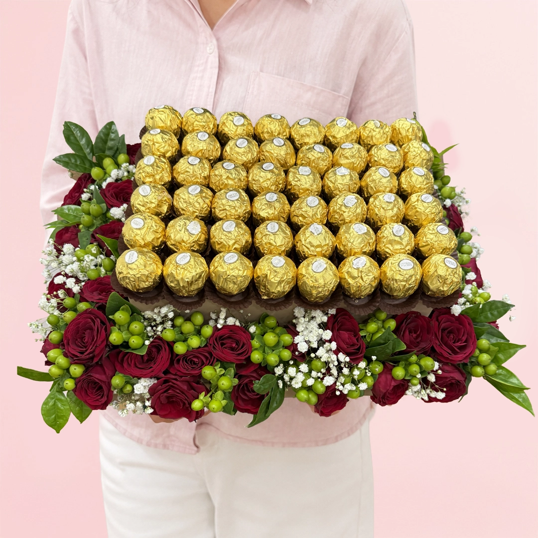 ferrero-rocher-roses-box-arrangement Decorative box arrangement with spray roses, berries, and Ferrero Rocher chocolates.