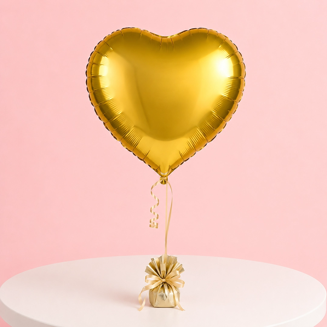 gold-heart-foil-celebration-balloon Gold heart-shaped foil balloon with metallic finish for celebrations