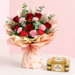 Rose and carnation flower bouquet arranged with 16Ferrero Rocher hazelnut chocolates