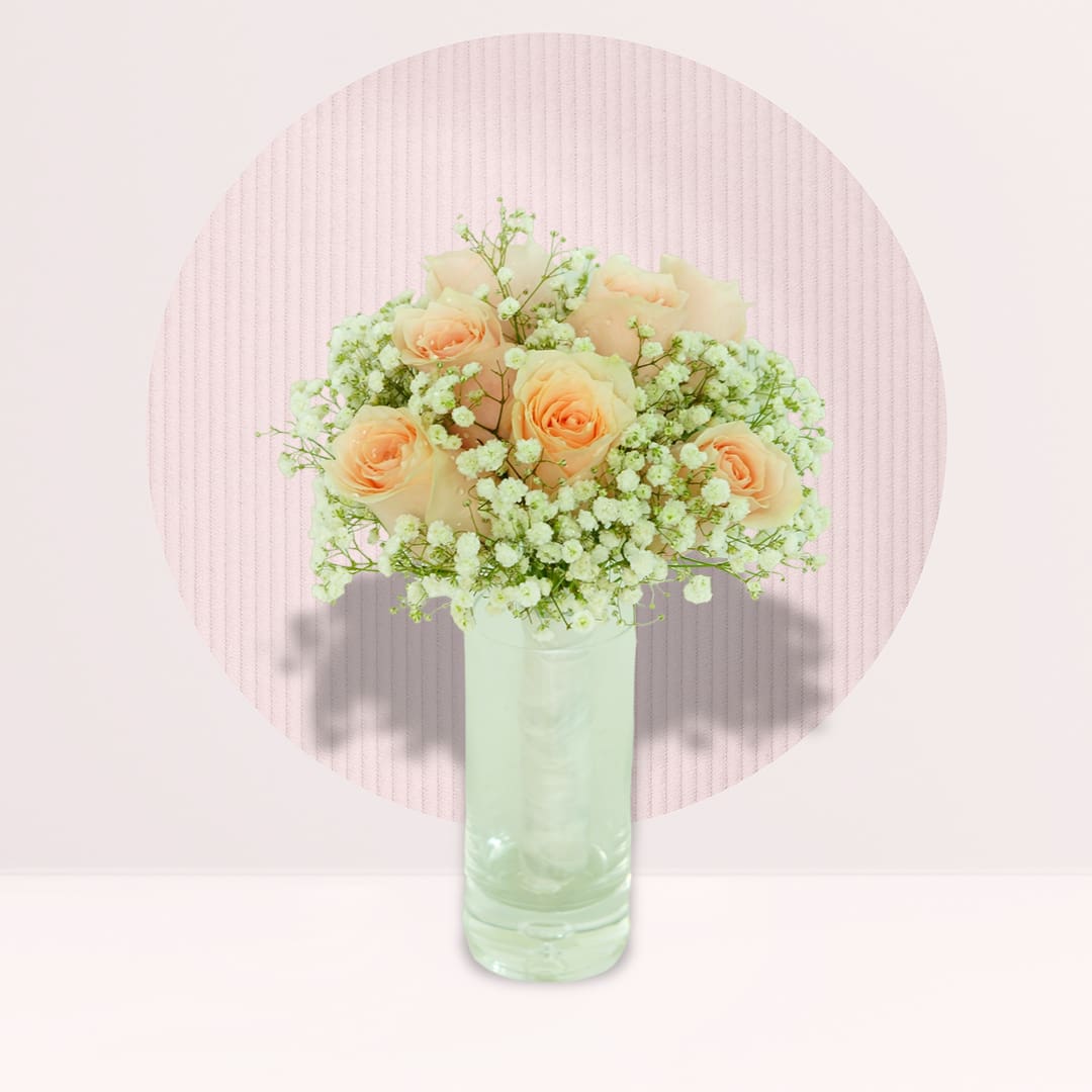 8 (5) Glass vase arrangement with 10 peach roses, seasonal greenery and delicate fillers.