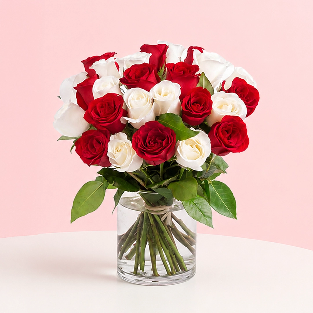 lovely-red-and-white-roses_2026 A bouquet of 8 red and 8 white roses in a cylinder vase, accompanied by a heartfelt message card, symbolizing love.