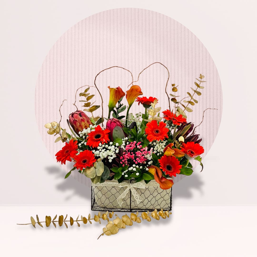 Box Of Flowers Cheerful flower arrangement featuring colourful fresh gerberas.