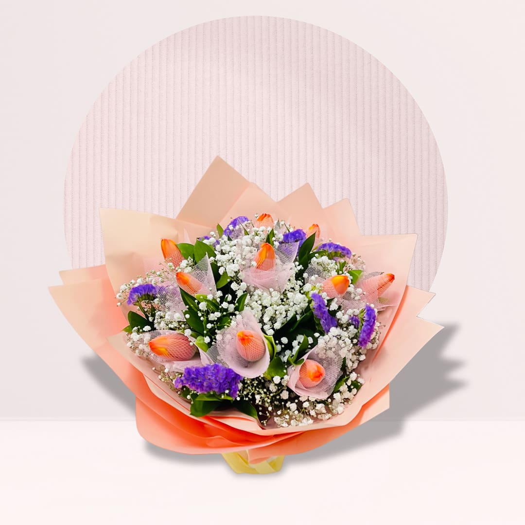 IMG_2501 Hand bouquet of orange tulips in soft pastel wrapping.