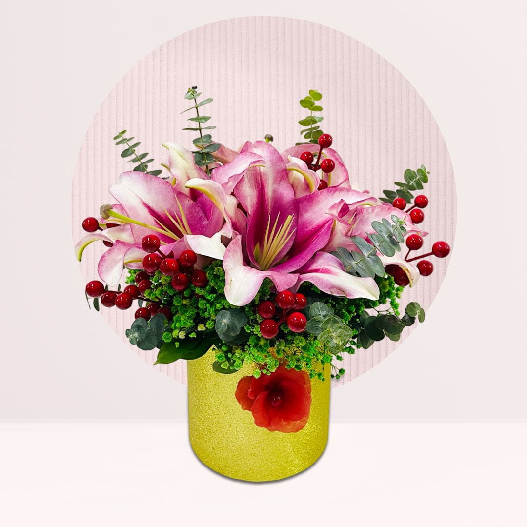 1 (203) Vase arrangement with pink lilies, red berries, baby’s breath and fresh greenery.