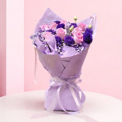 pink purple mixed rose and baby’s breath in lavender wrap