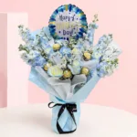 Father's Day Celebration Bouquet featuring roses, delphinium, baby’s breath, Ferrero Rocher chocolates, and a Happy Father's Day balloon arranged as a festive gift for Dad.