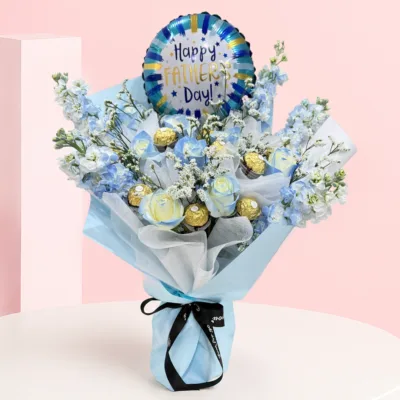 Father's Day Celebration Bouquet featuring roses, delphinium, baby’s breath, Ferrero Rocher chocolates, and a Happy Father's Day balloon arranged as a festive gift for Dad.
